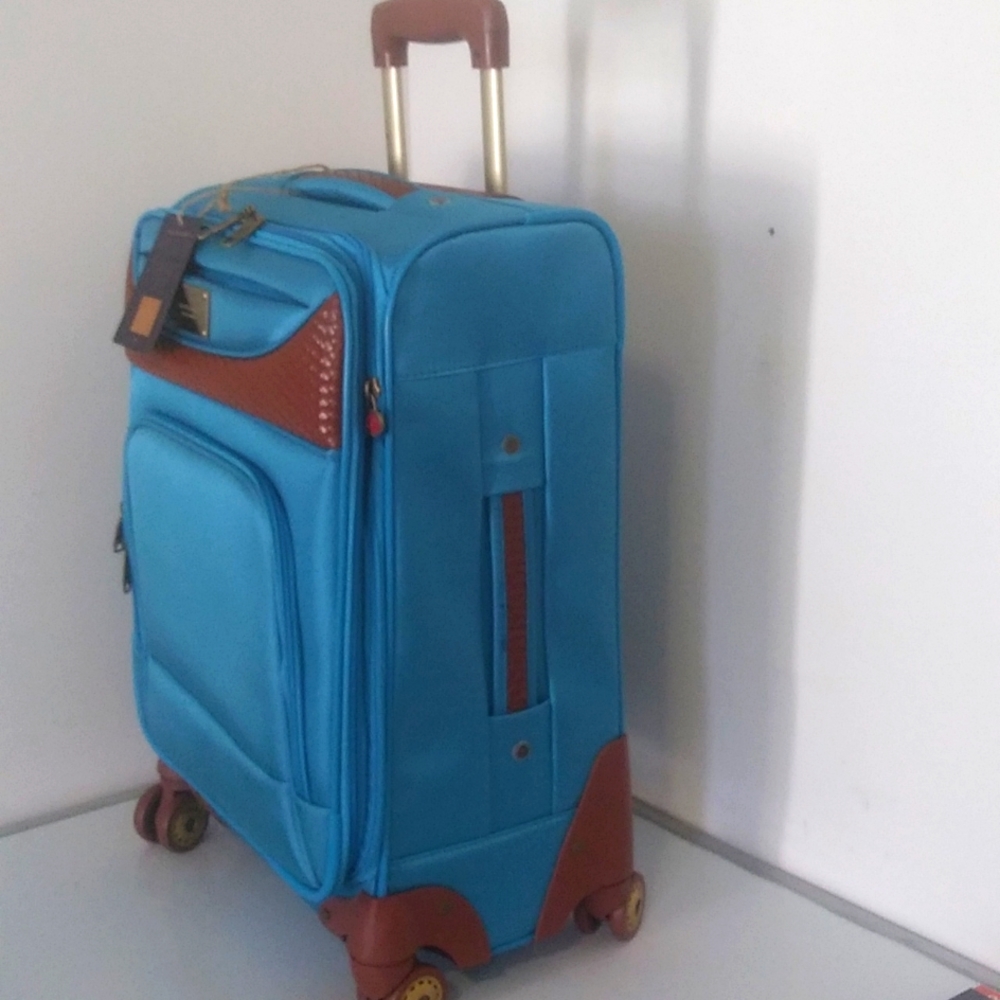 Softside, 20 Inch 8 Wheel Spinner Carry-On, Light Blue.